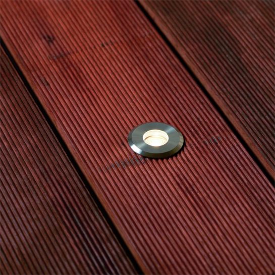 An Elluminate decklight installed in decking, Jarrah with grooves